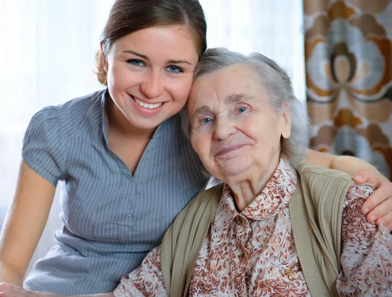 Lady with carer smiling