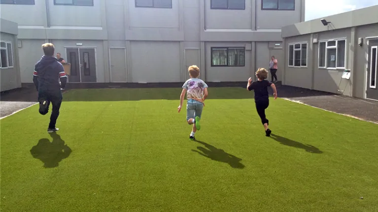 Children running on grass