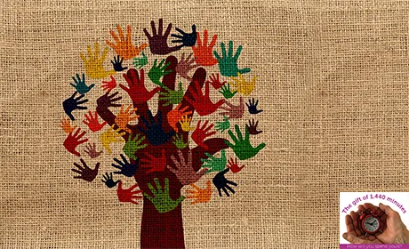 A tree with the leaves made out of handprints on a hessian background