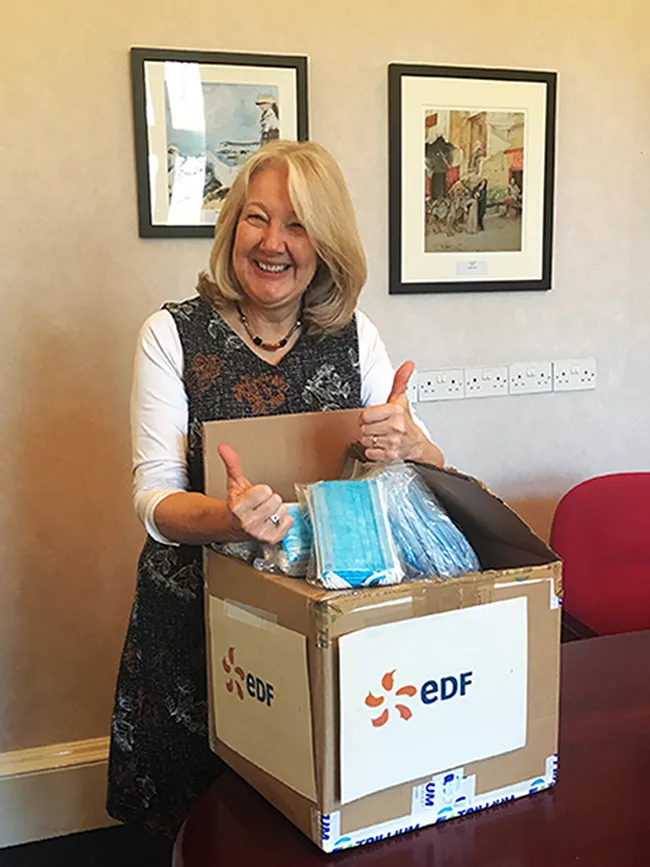 CEO Viv Dickenson with EDF donation of face masks