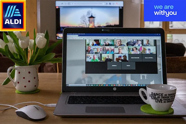Computer showing virtual meeting with partner logos
