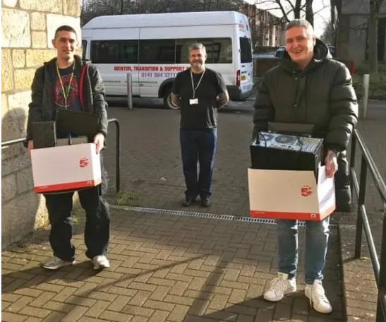 WhiteInch manager and 2 volunteers receiving computers