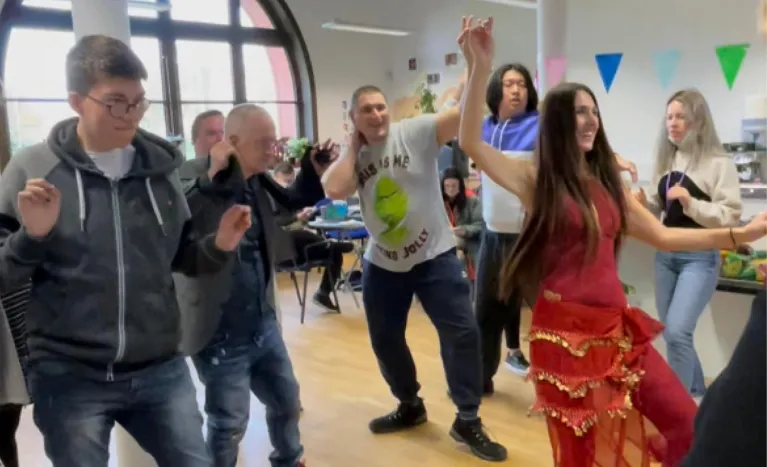 People at the National Forum Day try out Belly Dancing.